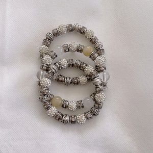 3 stretch bracelets with silver and rhinestones.